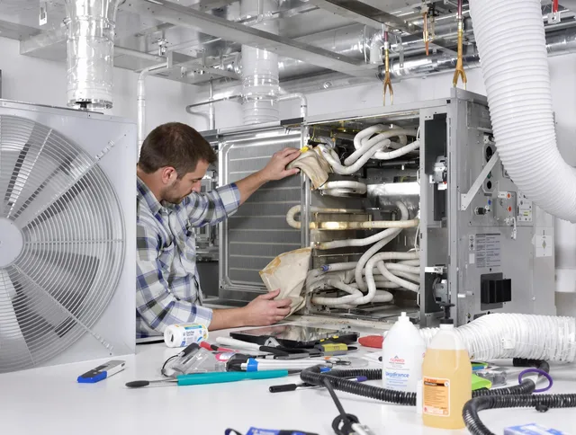 Uxbridge Air Duct Cleaning specialist performing precision AC coil cleaning in Uxbridge