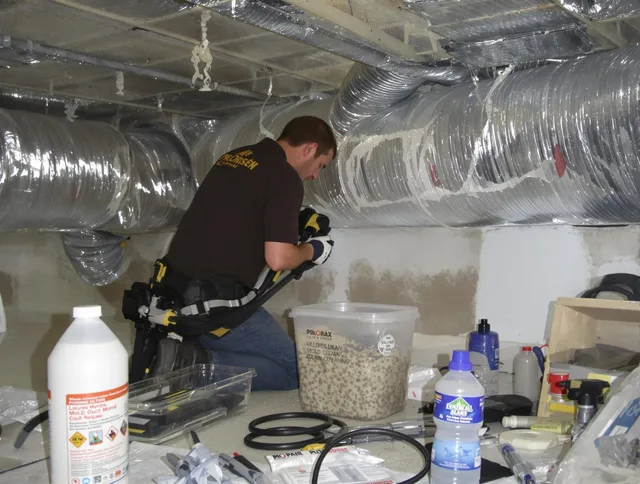 Uxbridge Air Duct Cleaning specialist performing professional mold removal from air ducts in Uxbridge