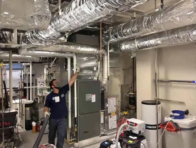 Uxbridge Air Duct Cleaning specialist performing thorough furnace duct cleaning in a Uxbridge residence