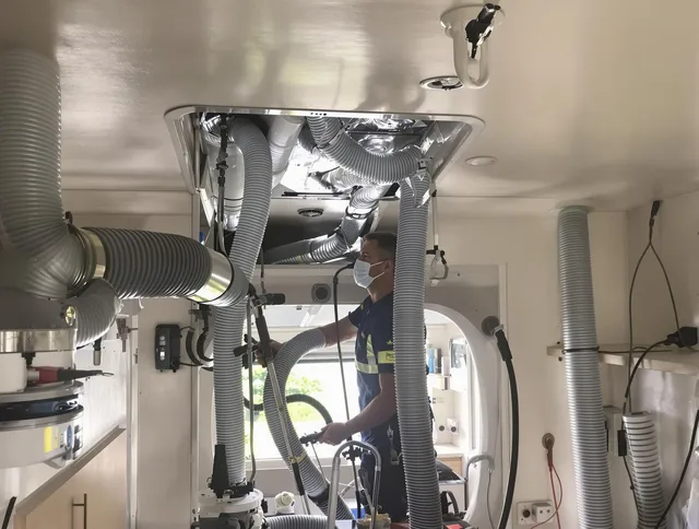 Uxbridge Air Duct Cleaning specialist performing precise mobile home duct cleaning in Uxbridge