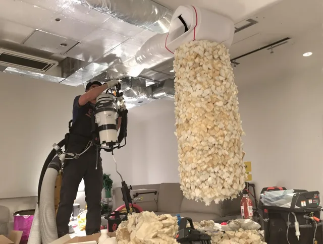 Uxbridge Air Duct Cleaning technician performing precision vacuum insulation removal in a residential property in Uxbridge